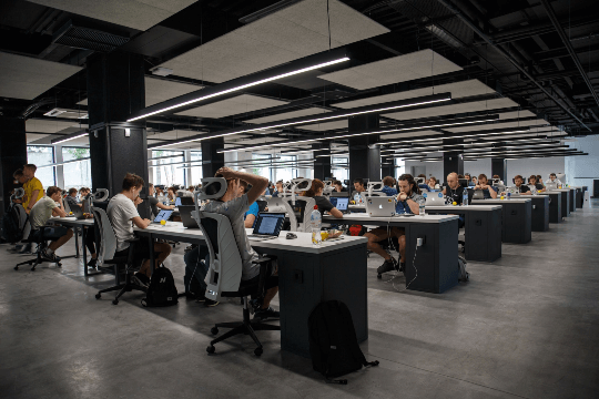 Developers working in large tech company office